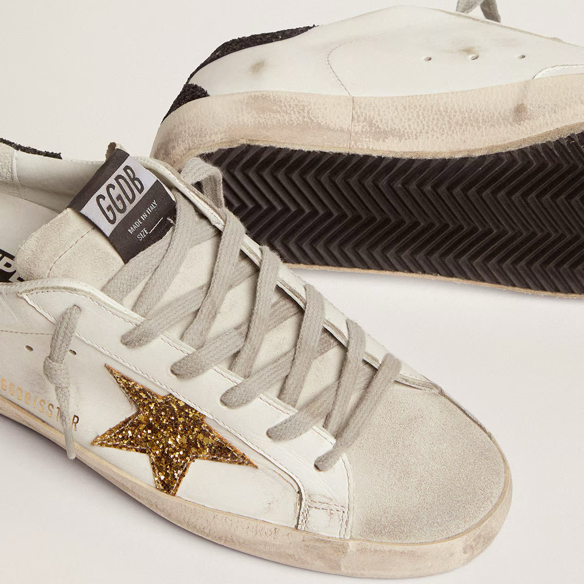 gold glitter star and black glitter heel tab